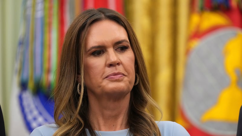 Arkansas Gov. Sarah Huckabee Sanders listens as President Donald Trump speaks during an event...