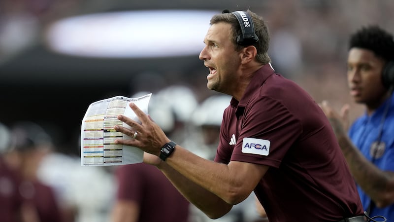 FILE - Missouri State head coach Casey Woods claps up his defernse after a stop agaisnt Texas...