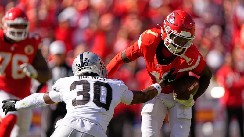 Kansas City Chiefs wide receiver Xavier Worthy (1) runs with the ball as Las Vegas Raiders...