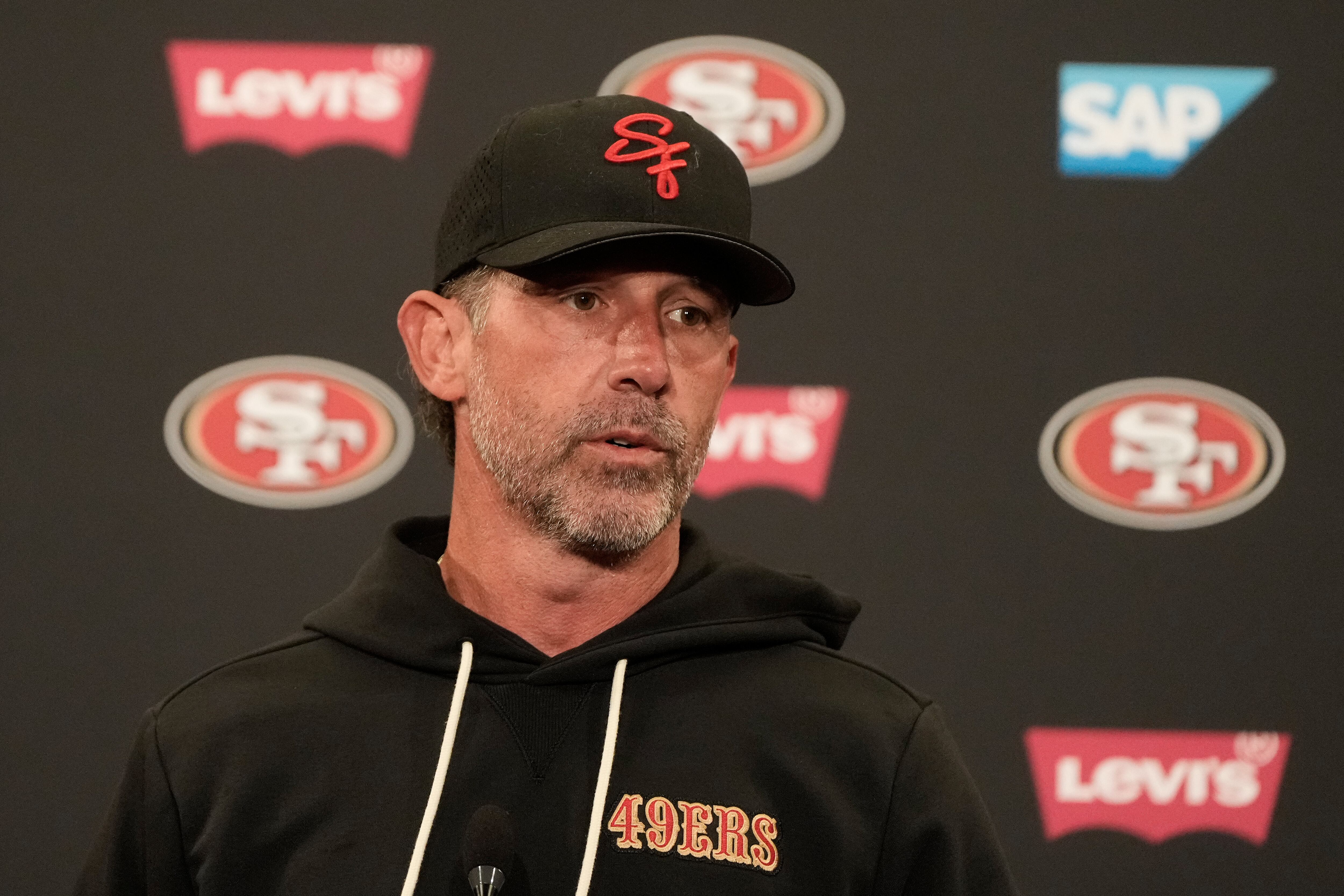 49ers coach Kyle Shanahan hurt in a car crash , limited as training camp opens