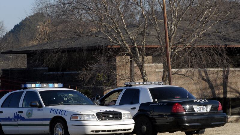 FILE - Police cruisers are stationed outside the Arkansas State Medical Board building during...