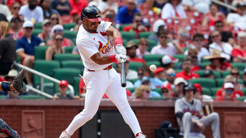 St. Louis Cardinals' José Fermín hits a two-run single during the sixth inning of a baseball...