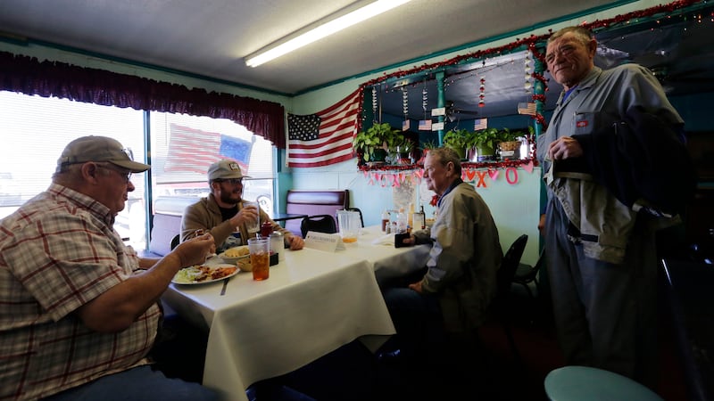 In this Wednesday, Jan. 23, 2019, photo, Gene Henderson, from left, Brandon Henderson, and...