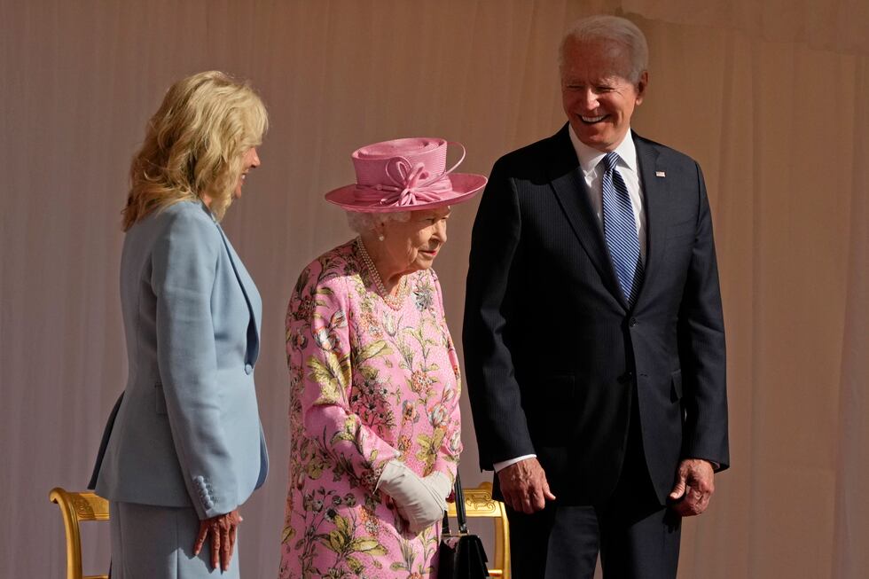 FILE - President Joe Biden and first lady Jill Biden smile while standing with Britain's Queen...