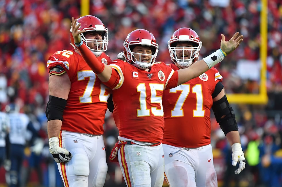 Kansas City Chiefs' Patrick Mahomes (15) celebrates a touchdown pass with Eric Fisher (72) and...
