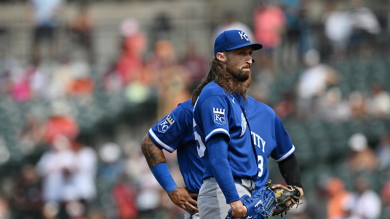 Kansas City Royals pitcher Matt Strahm, front, pauses after giving up four runs to the...