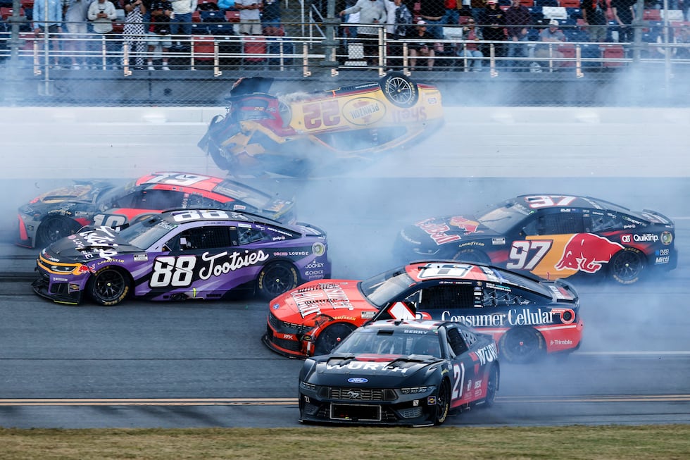 Joey Logano (22) flips after wrecking with Chase Briscoe (19) and involving multiple drivers...