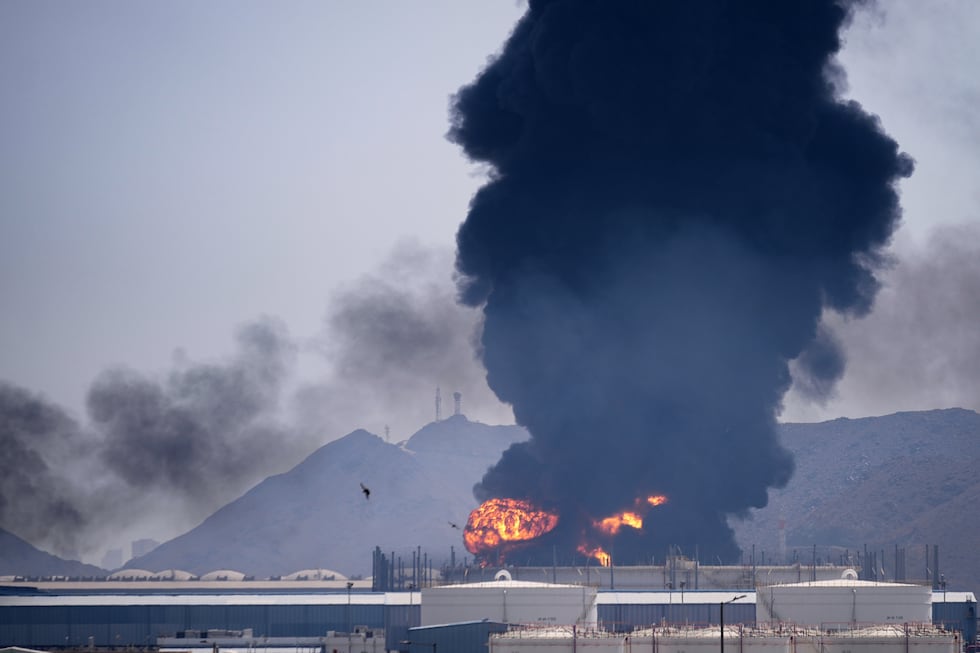 RELATED IMAGE: A fire and plume of smoke rise after, according to authorities. debris from an...