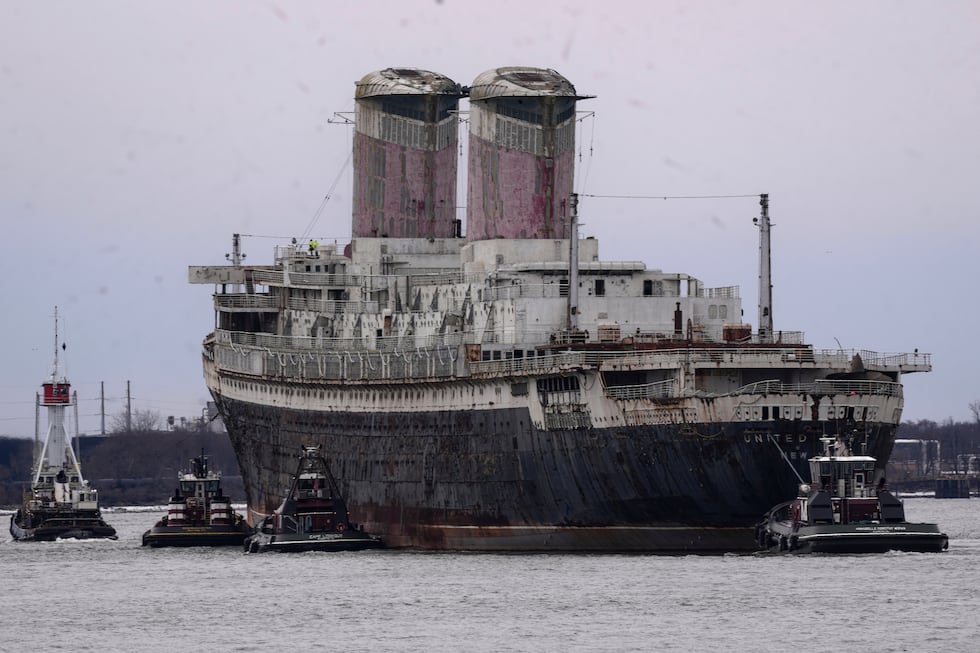 FILE - The SS United States is towed down the Delaware River between Pennsylvania and New...