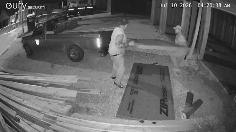 The two men were seen loading plywood into their truck.