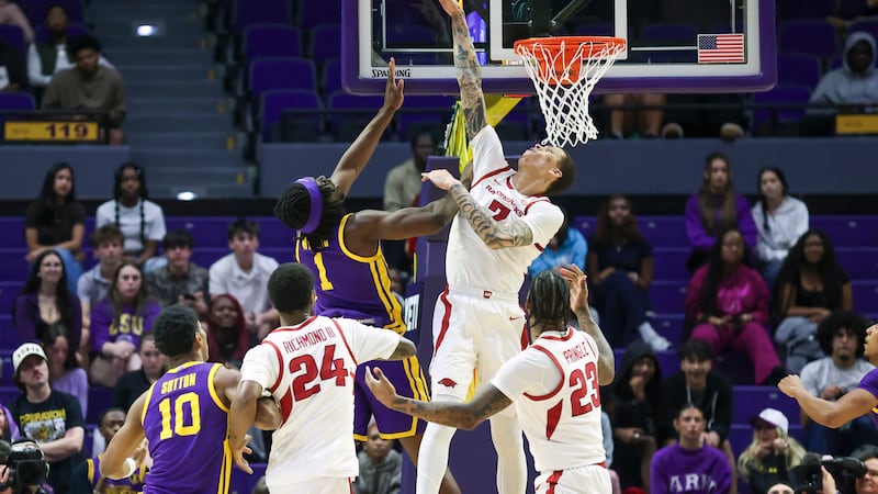 Arkansas forward Trevon Brazile blocks a shot by LSU center Michael Nwoko (1) during the first...
